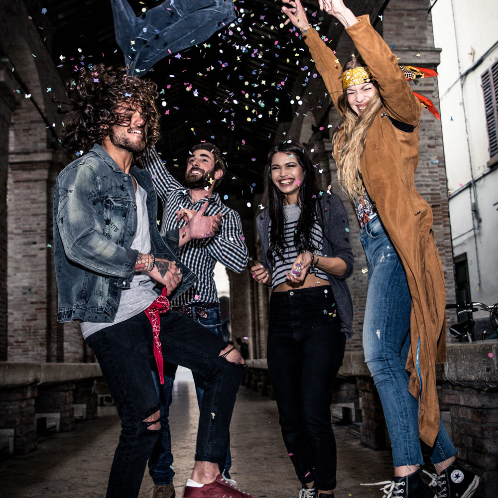 spontaneous group of friends dancing in the streets